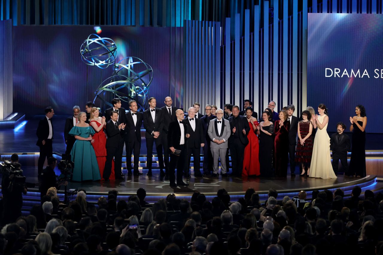 Jesse Armstrong, center, and the cast and crew of “Succession" accept the award for outstanding drama series at the 75th Emmy Awards in Los Angeles in January. 