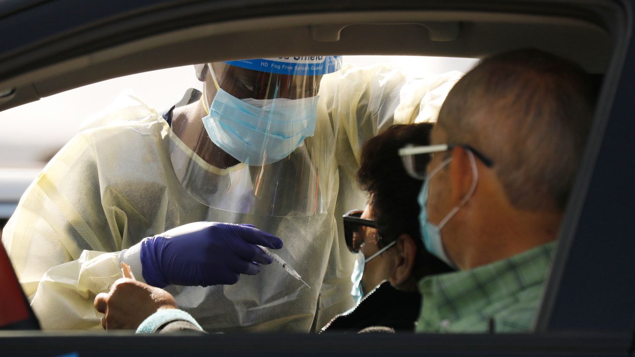 Staff and volunteers distribute the Covid-19 vaccine on Tuesday, January 19, in Inglewood, California.