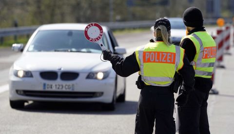 German Federal police officers control vehicles at the border to France in Saarbruecken, Germany, on March 26.