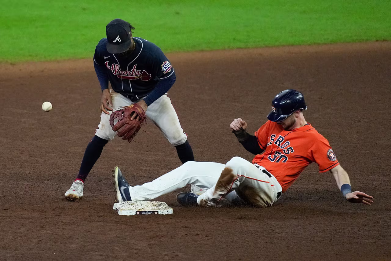 Houston Astros' Kyle Tucker is safe at second on a fielding error by Atlanta Braves second baseman Ozzie Albies during the sixth inning in Game 2.
