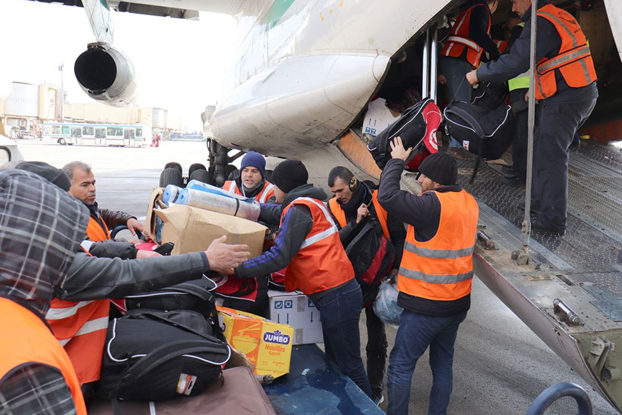 Men unload?supplies?from an Algerian plane at an airport, in Aleppo,?Syria, February 7..?