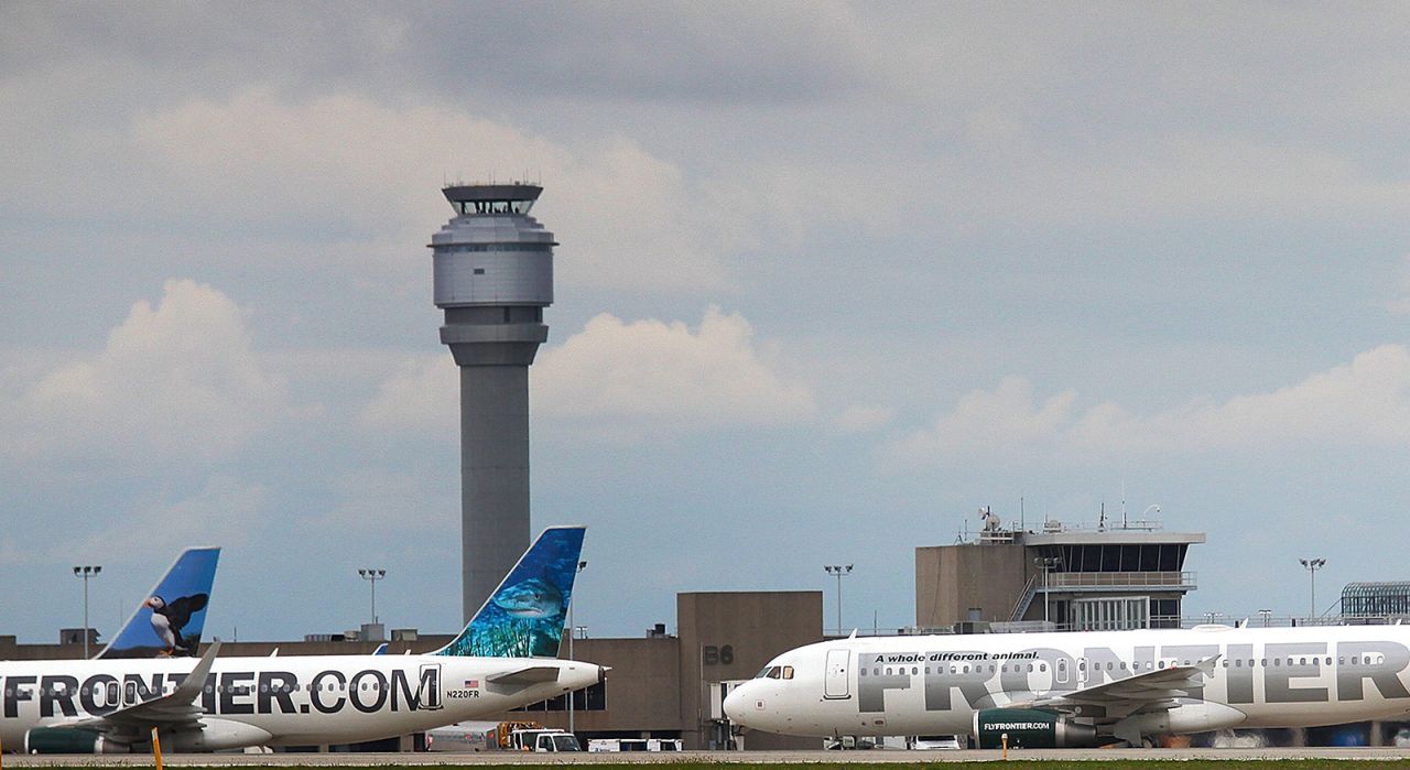 A Frontier Airlines plane taxis the runway at Cleveland Hopkins Airport on October 15, 2014 in Cleveland, Ohio. 