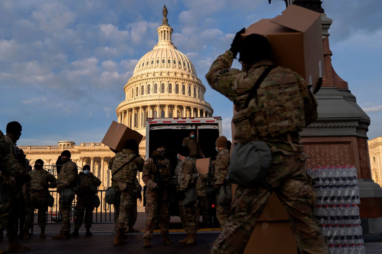 National Guard members unload supplies outside the US Capitol on January 14, in Washington, DC.