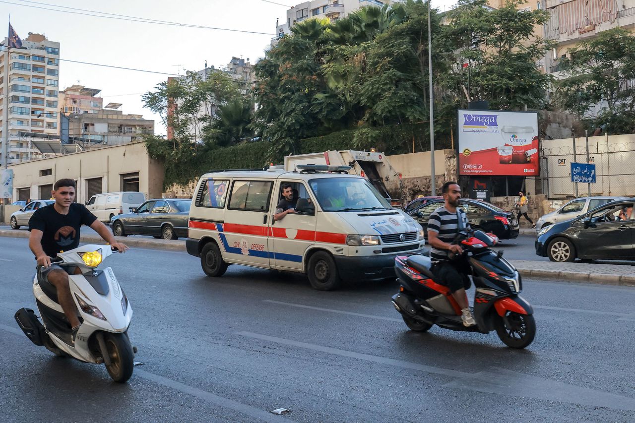 A Lebanese Red Cross ambulance rushes wounded people to a hospital in Beirut on September 17, after explosions hit locations in several Hezbollah strongholds.