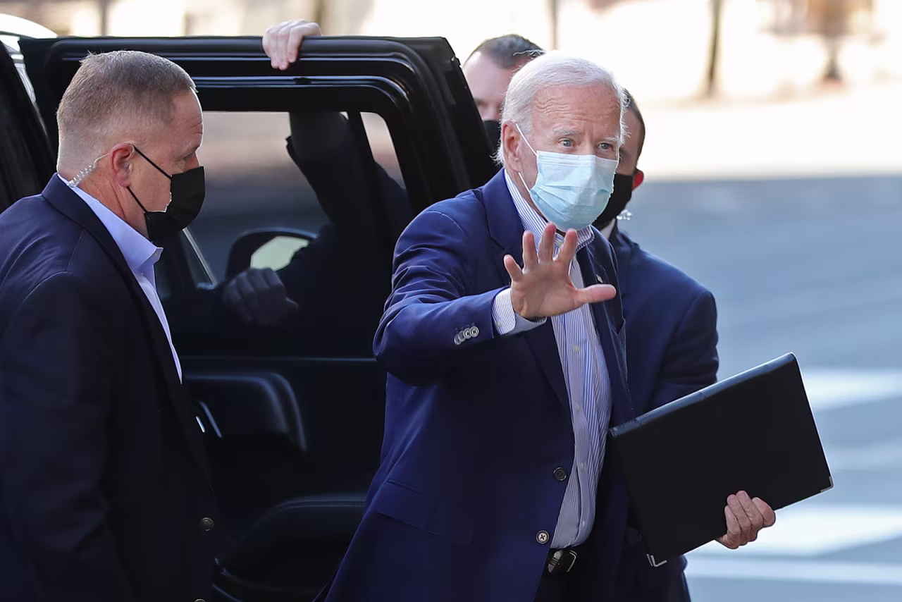 Joe Biden waves to journalists on October 3 in Wilmington, Delaware. 
