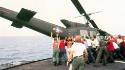 A helicopter is pushed over the side of the aircraft carrier the USS Midway on April 29, 1975.