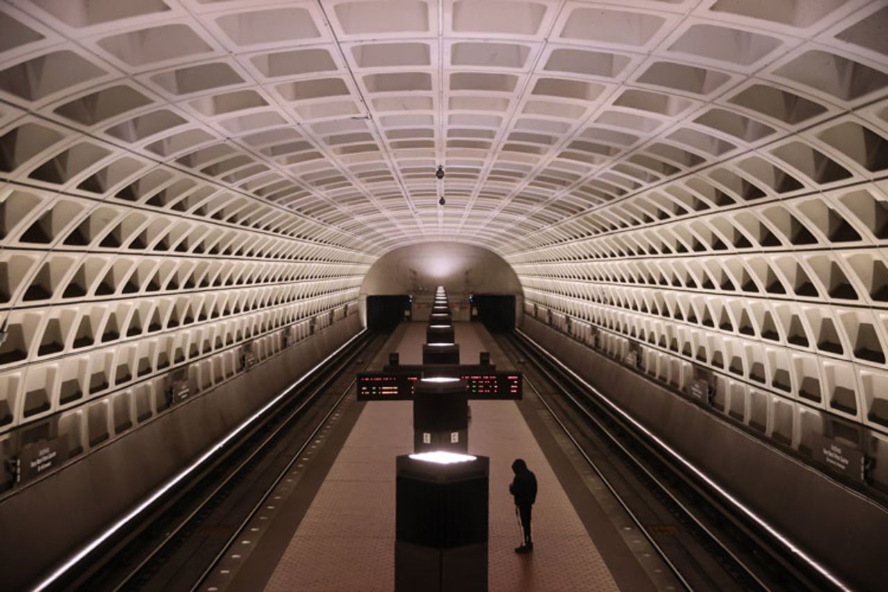 A single rider waits on a train platform at the Archives station in Washington on Wednesday.