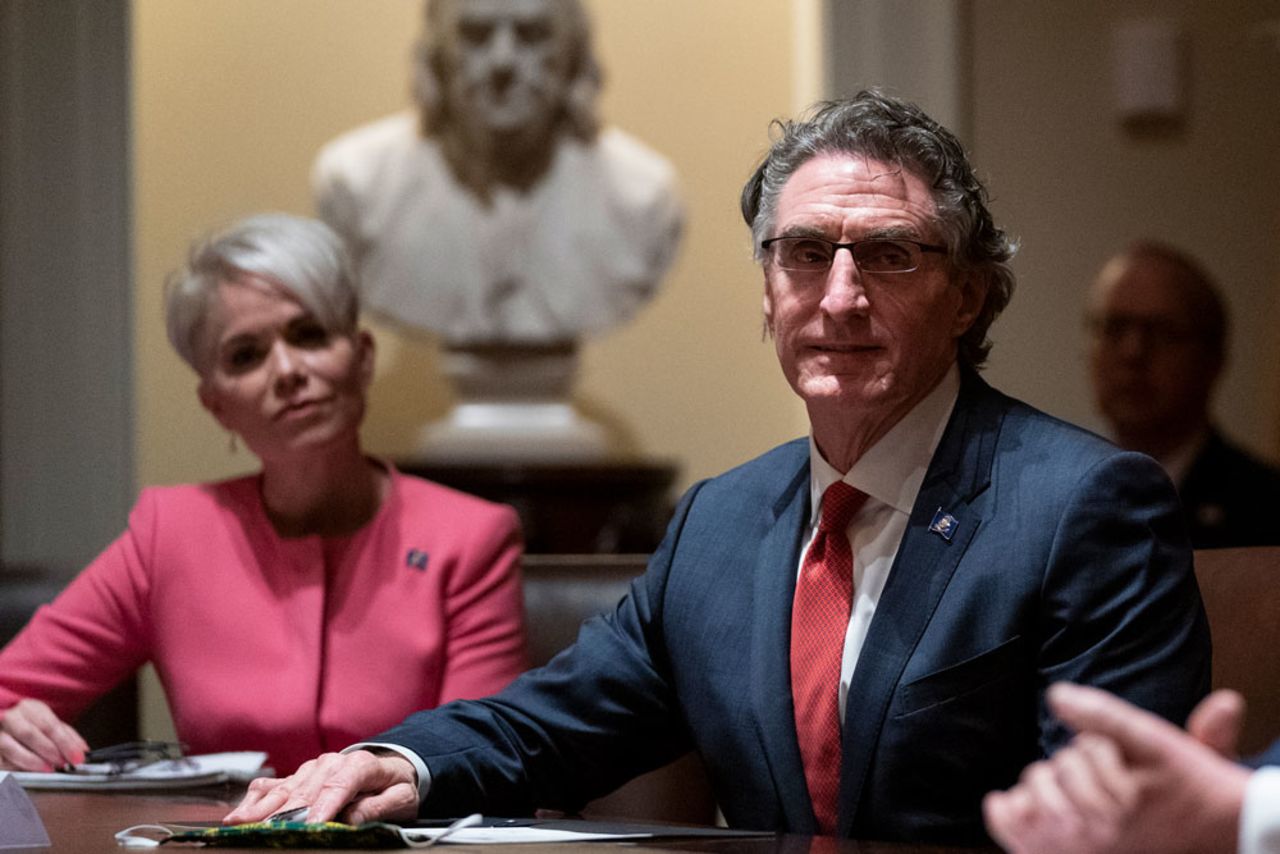 Michelle Kommer, commissioner of the North Dakota Department of Commerce, left, and North Dakota Gov. Doug Burgum, center, listen as President Donald Trump speaks during a meeting about the coronavirus response at the White House on Wednesday, May 13, in Washington.