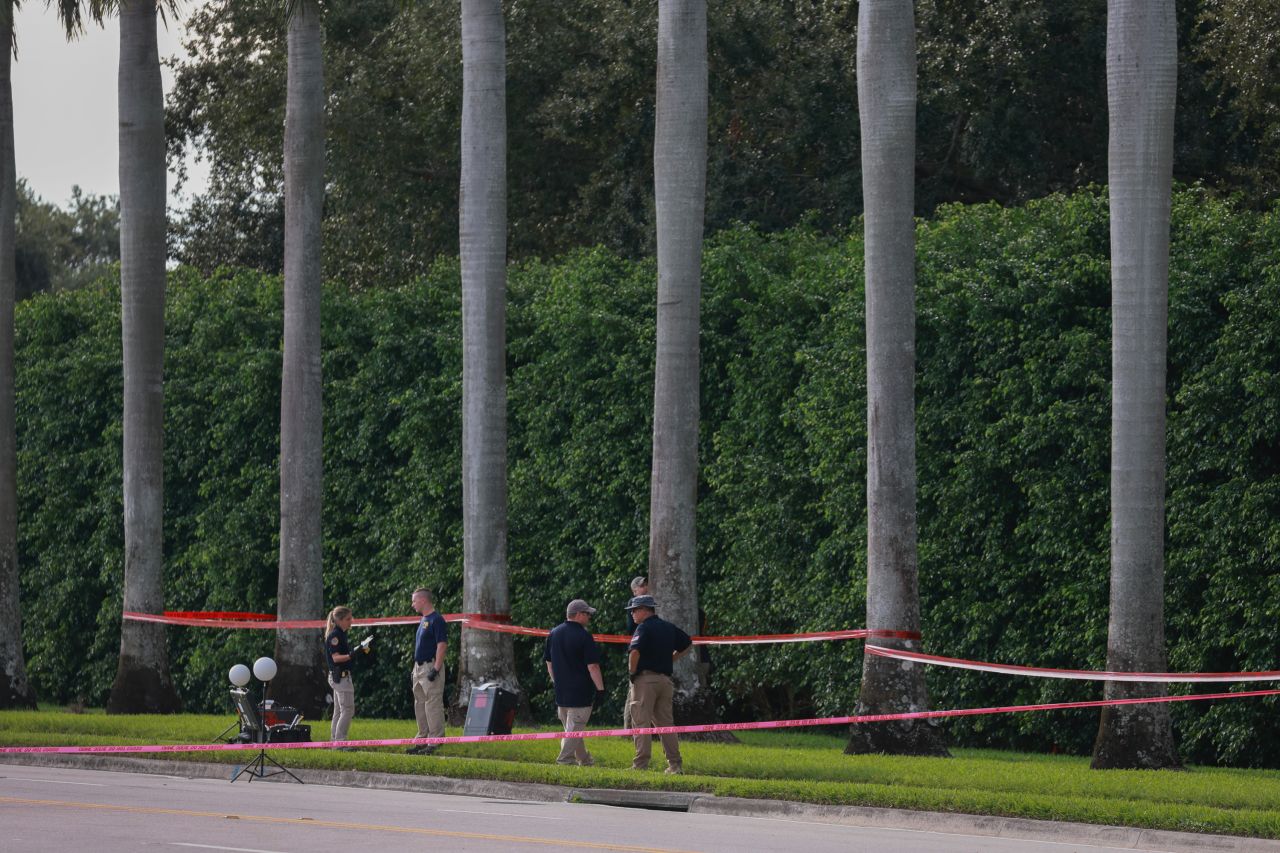 Law enforcement personnel investigate the area around Trump International Golf Club after an apparent assassination attempt on former President Donald Trump in West Palm Beach, Florida, on September 16.