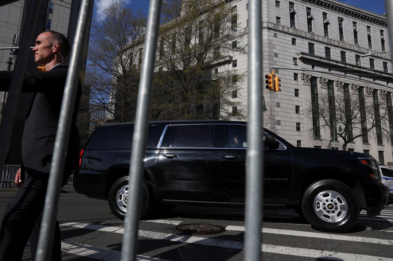 The motorcade of former President Donald Trump passes by outside the courthouse in New York on Monday.