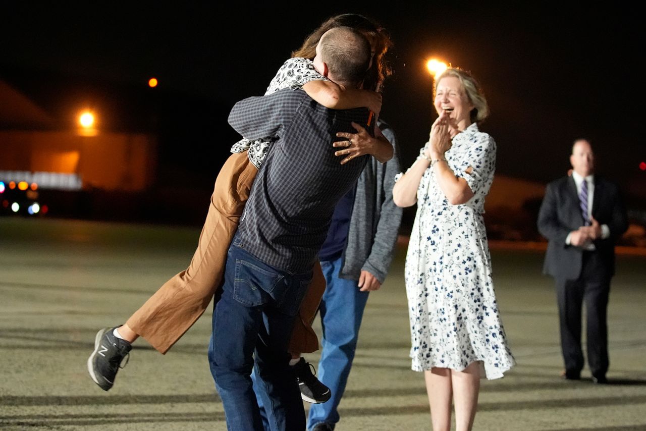 Reporter Evan Gershkovich hugs his mother Ella Milman at Joint Base Andrews on Thursday.