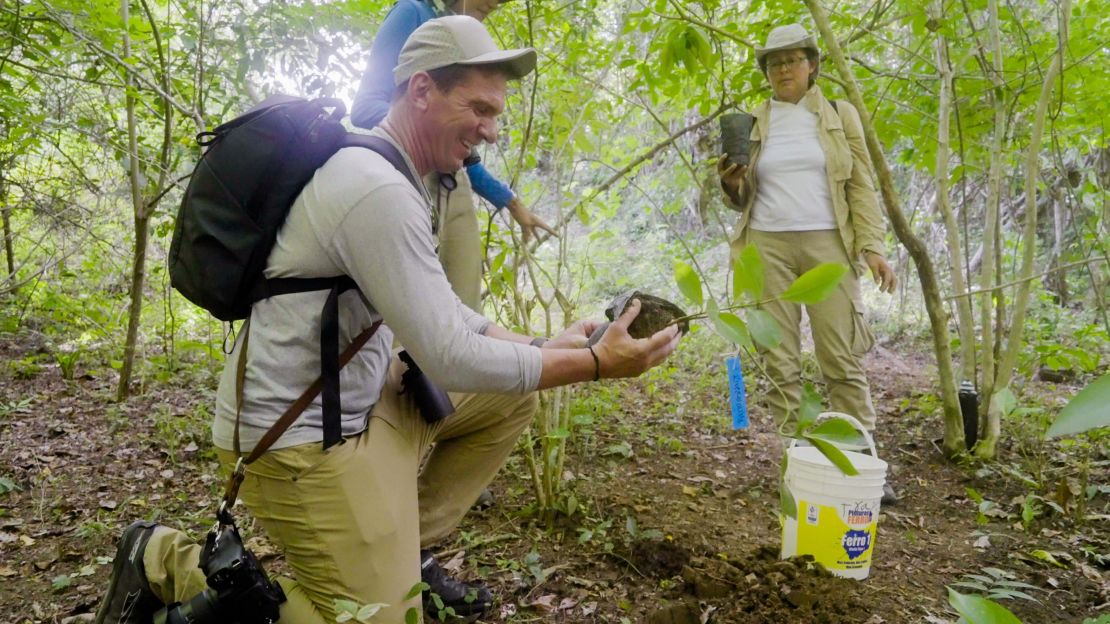 Bill plants a tree in the name of his children, River and Olivia, in Colombia in 2023.