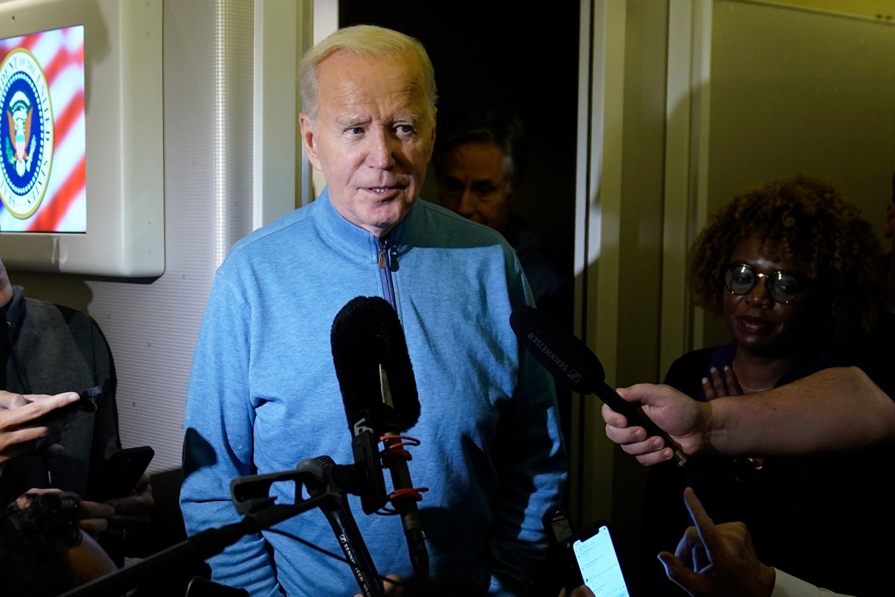 Joe Biden talks to reporters at Ramstein Air Base in Germany, on October 18.