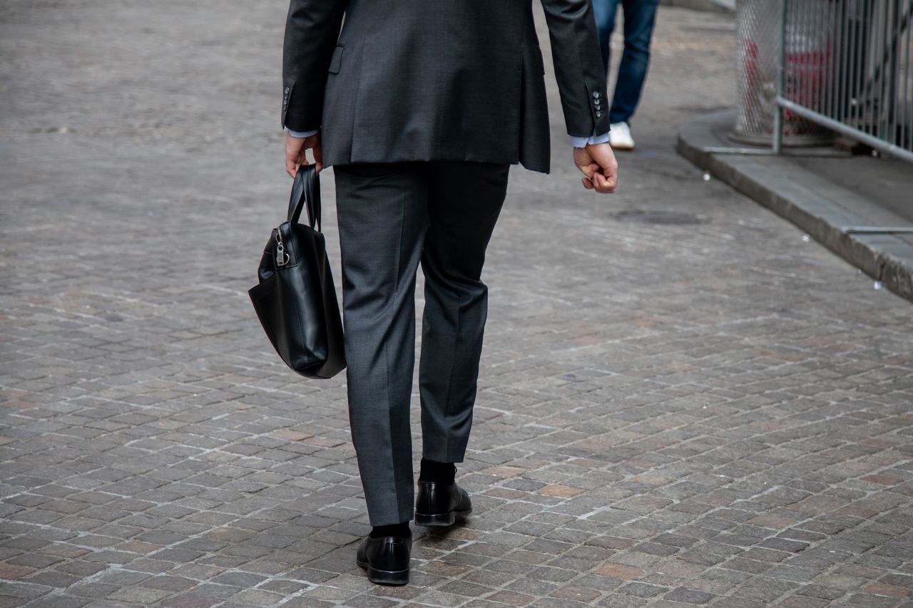 A pedestrian walks along Wall Street in New York City on June 9, 2023. 