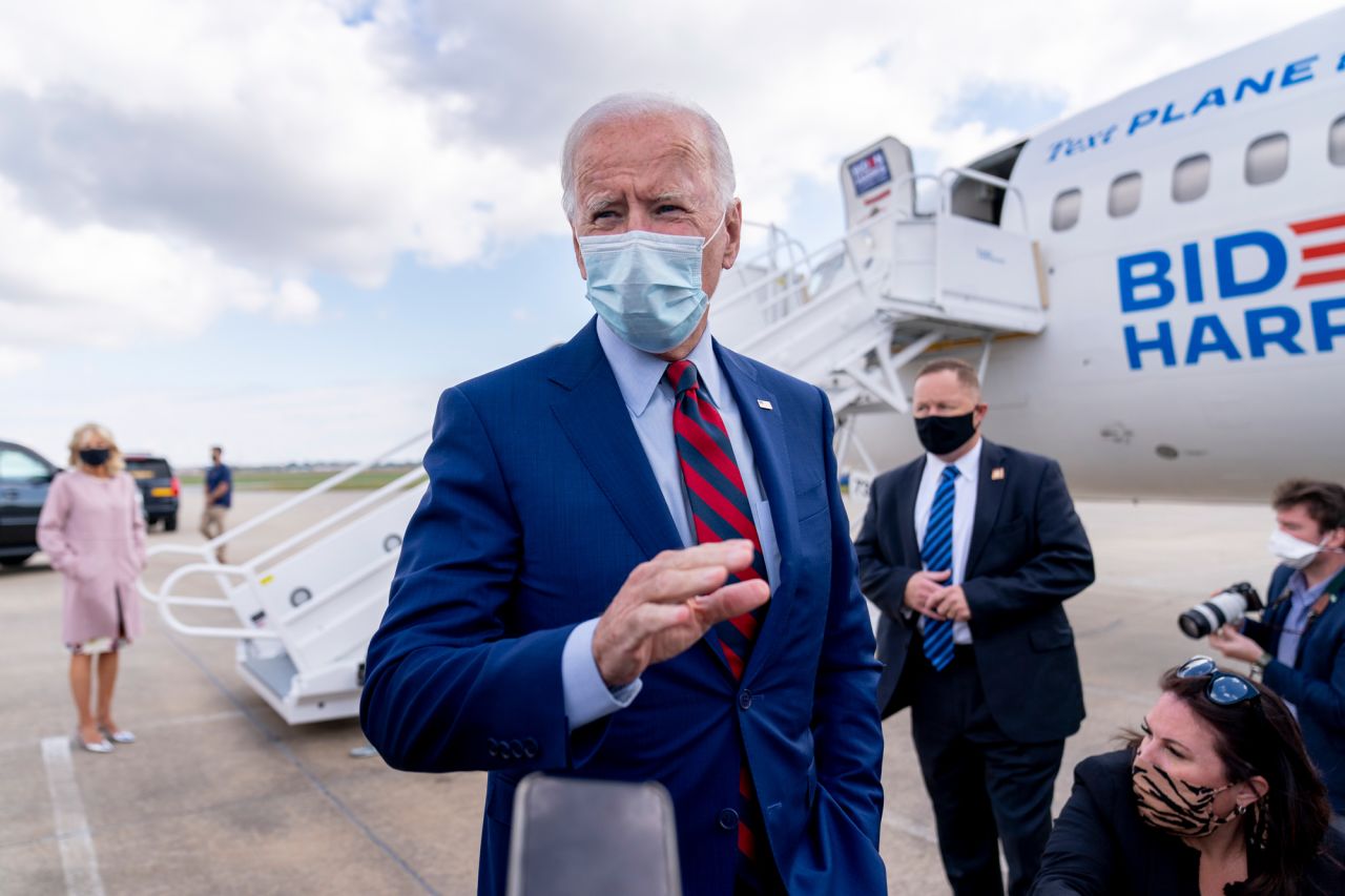 Democratic presidential candidate Joe Biden speaks to members of the media before boarding his campaign plane at New Castle Airport in New Castle, Delaware, on October 5.