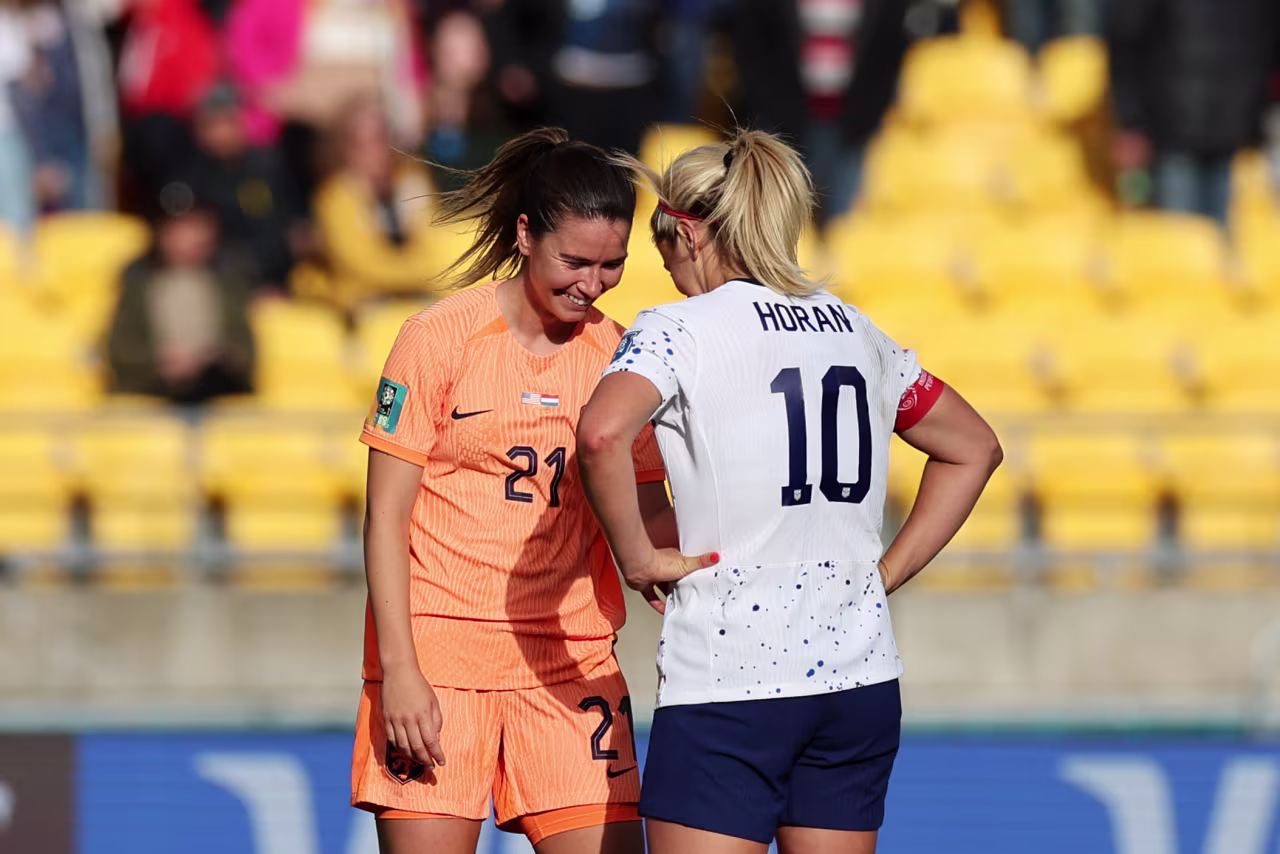 Damaris Egurrola of Netherlands and Lindsey Horan of USA embrace after the 1-1 draw.