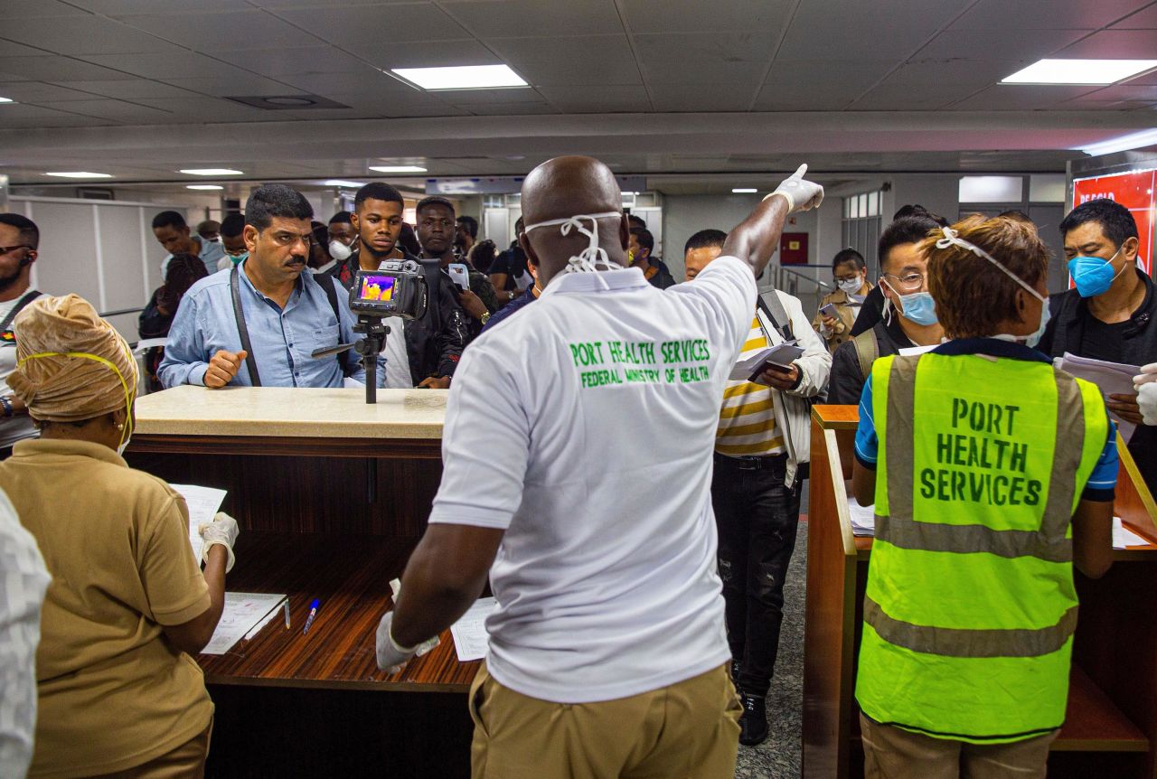 Health officials screen passengers at Murtala International Airport in Lagos, Nigeria, on March 2.