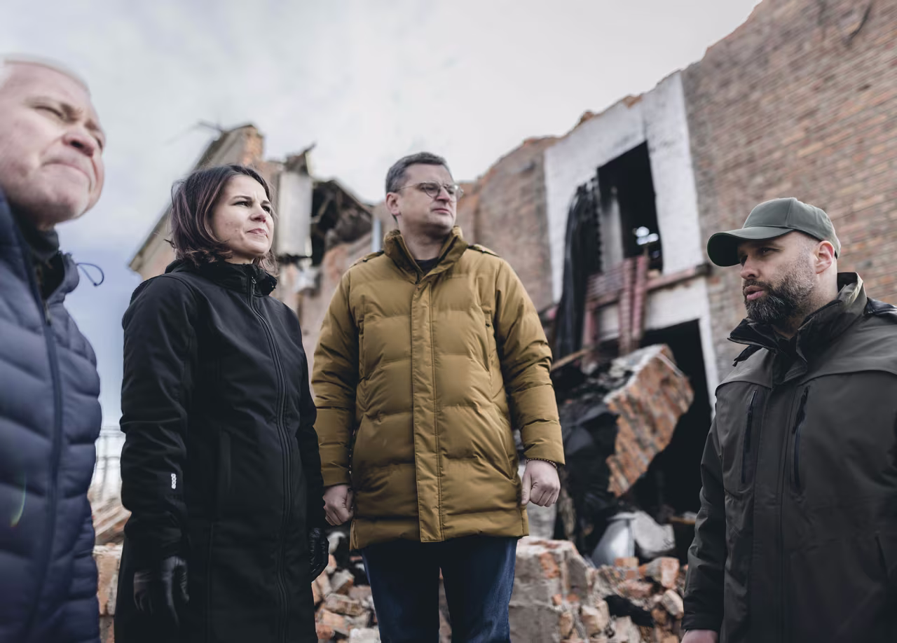 German Foreign Minister Annalena Baerbock and Ukraine's Foreign Minister, Dmytro Kuleba, visit a destroyed boiler system in Kharkiv, Ukraine, on January 10.