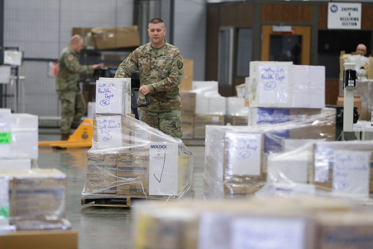 An Indiana National Guardsman lines up a pallets of medical supplies in Indianapolis on Thursday, March 26.