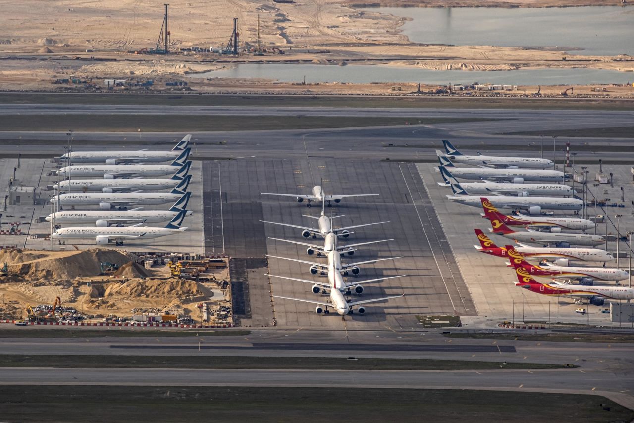 Aircraft operated by Cathay Pacific and Hong Kong Airlines sit parked on the tarmac at Hong Kong International Airport on March 5.