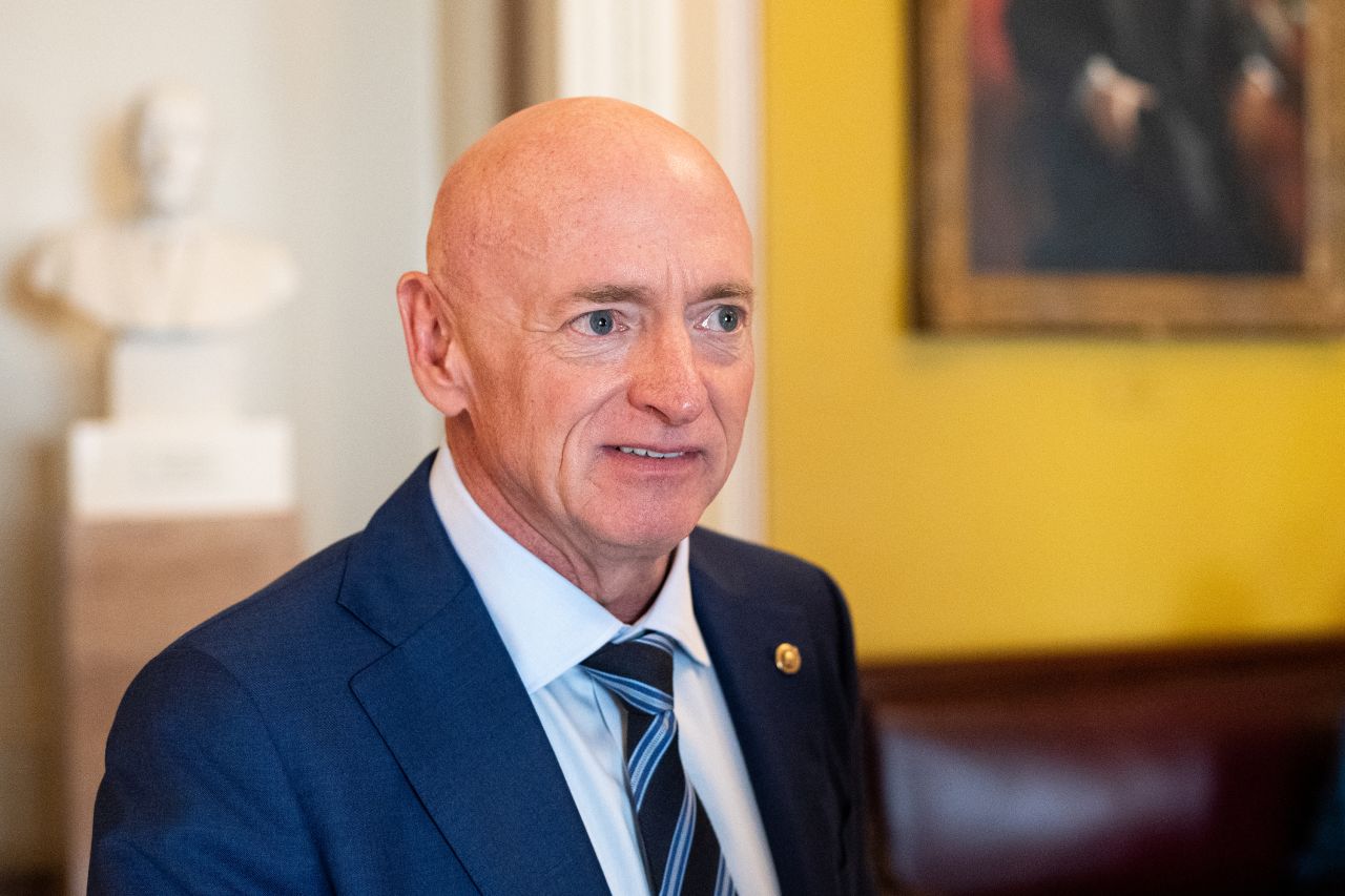 Sen. Mark Kelly speaks to reporters after a vote in the Capitol on Tuesday, July 30.