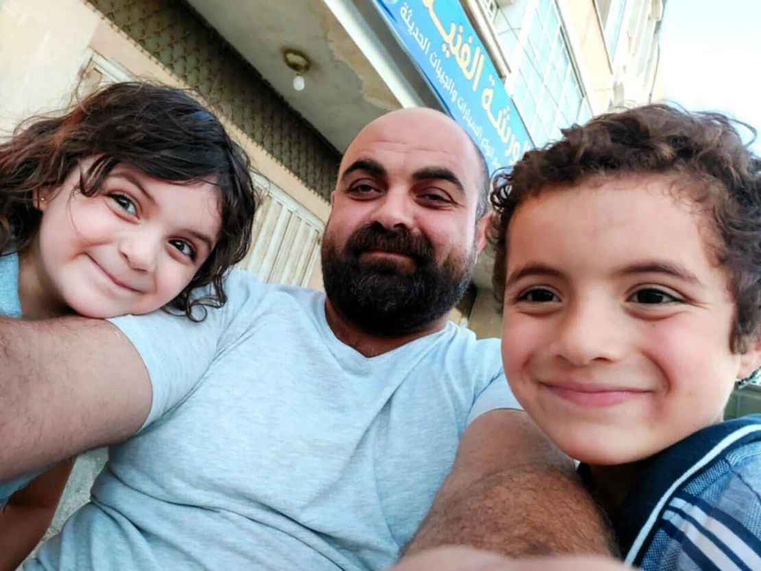 Eve al-Najjar (left) and Raslan al-Najjar (right), who were both killed in an Israeli airstrike, pictured with their father, Dr. Hamdi al-Najjar (center).