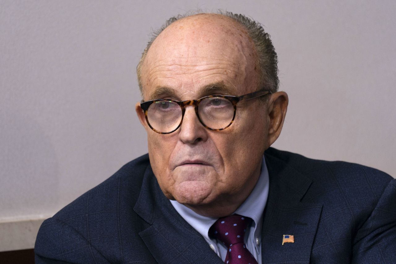 Rudy Giuliani listens during a news conference at the White House on September 27.