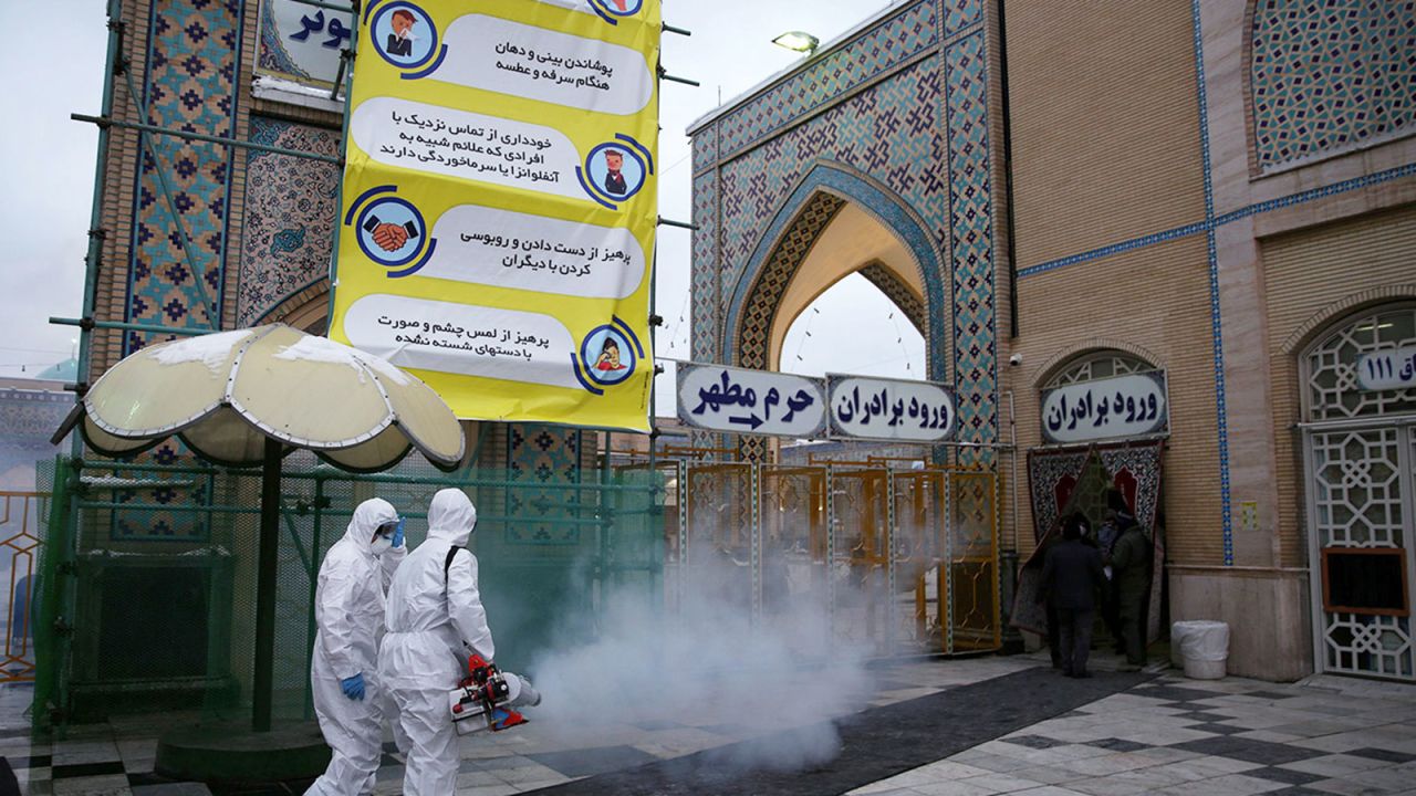 Members of the medical team spray disinfectant to sanitize outdoor place of Imam Reza's holy shrine, following the coronavirus outbreak, in Mashhad, Iran on February 27.