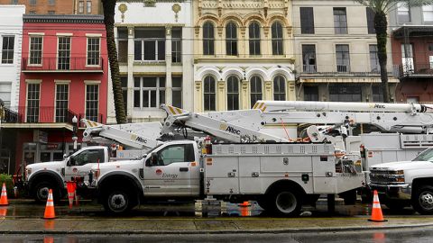 Entergy Corp. electric utility company bucket trucks are staged on Canal Street in New Orleans, Louisiana on Sunday, August 29. 
