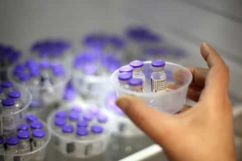 A nurse removes vials of the Pfizer/BioNTech Covid-19 vaccine from a fridge at a vaccination center in Ajaccio, France, on May 13. 