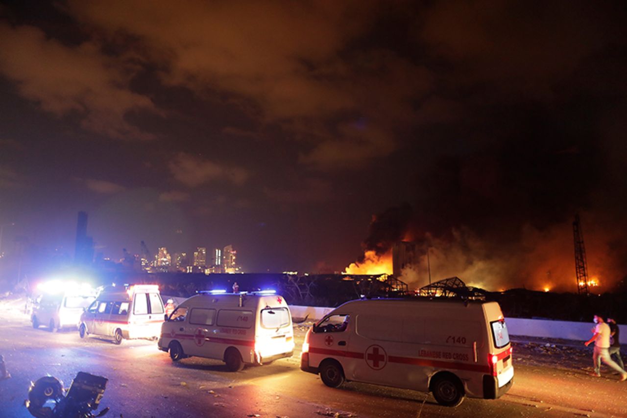 Ambulances drive past the site of the explosion.