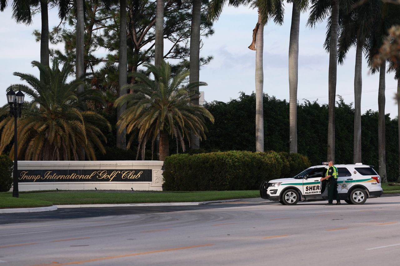 ?Law enforcement secure the area around Trump International Golf Club  in West Palm Beach, Florida, after an apparent assassination attempt of former President Donald Trump on September 15.