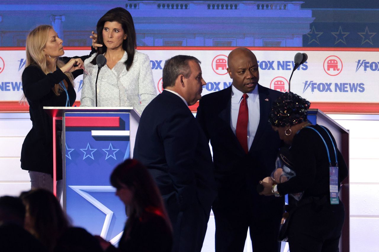 Republican presidential candidates former South Carolina Gov. Nikki Haley, former New Jersey Gov. Chris Christie and Sen. Tim Scott take a break during the first debate.