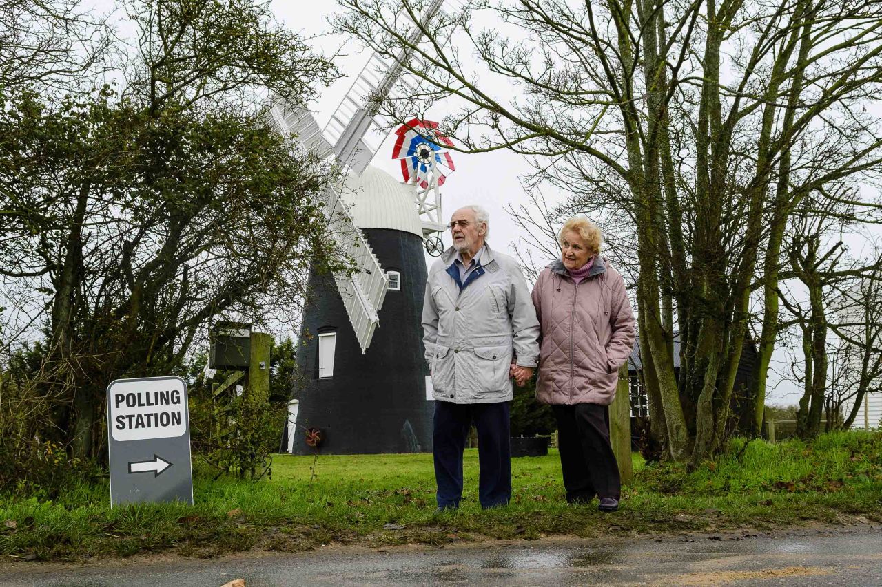 Voters are seen outside a polling station at Thelnetham Windmill in Diss, England. Photo: Mark Bullimore/Getty Images