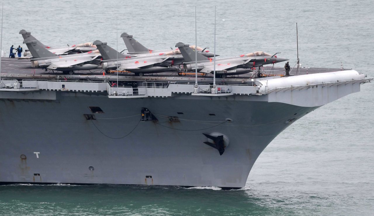 The French aircraft carrier Charles de Gaulle enters the port of Brest, France on March 13.