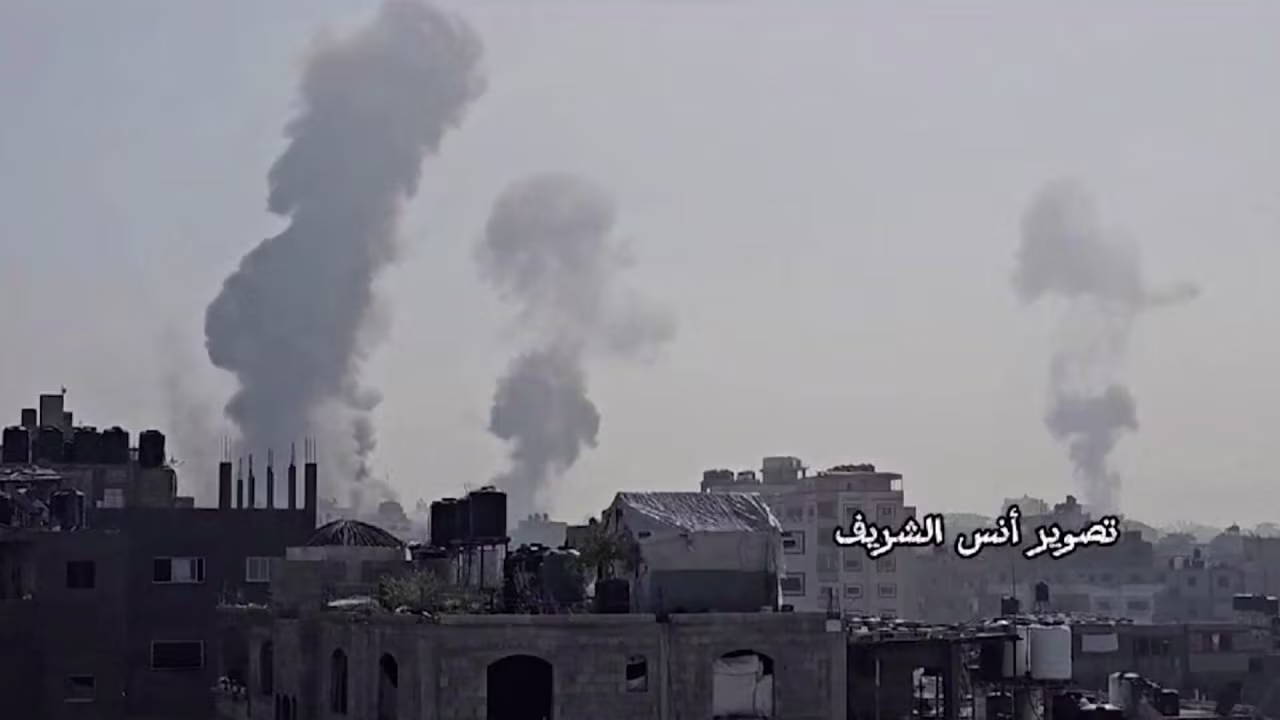 In this still from video obtained by Reuters, smoke fills the air in Jabalya, Gaza, on Sunday, December 3.