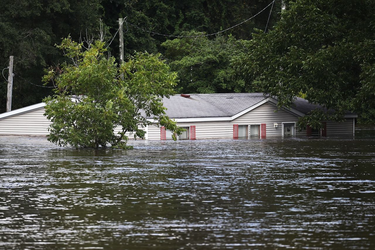 Flood waters are seen around a home in Spring Lake, North Carolina, in 2018 after Hurricane Florence. 