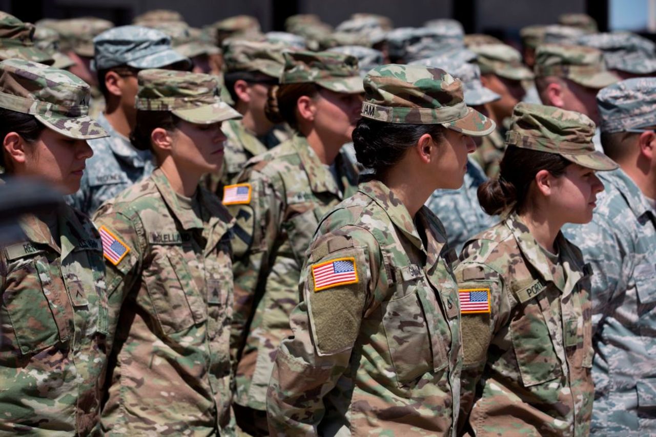 Members of the Arizona National Guard listen to instructions on April 9, 2018, at the Papago Park Military Reservation in Phoenix. Arizona deployed its first 225 National Guard members to the Mexican border.