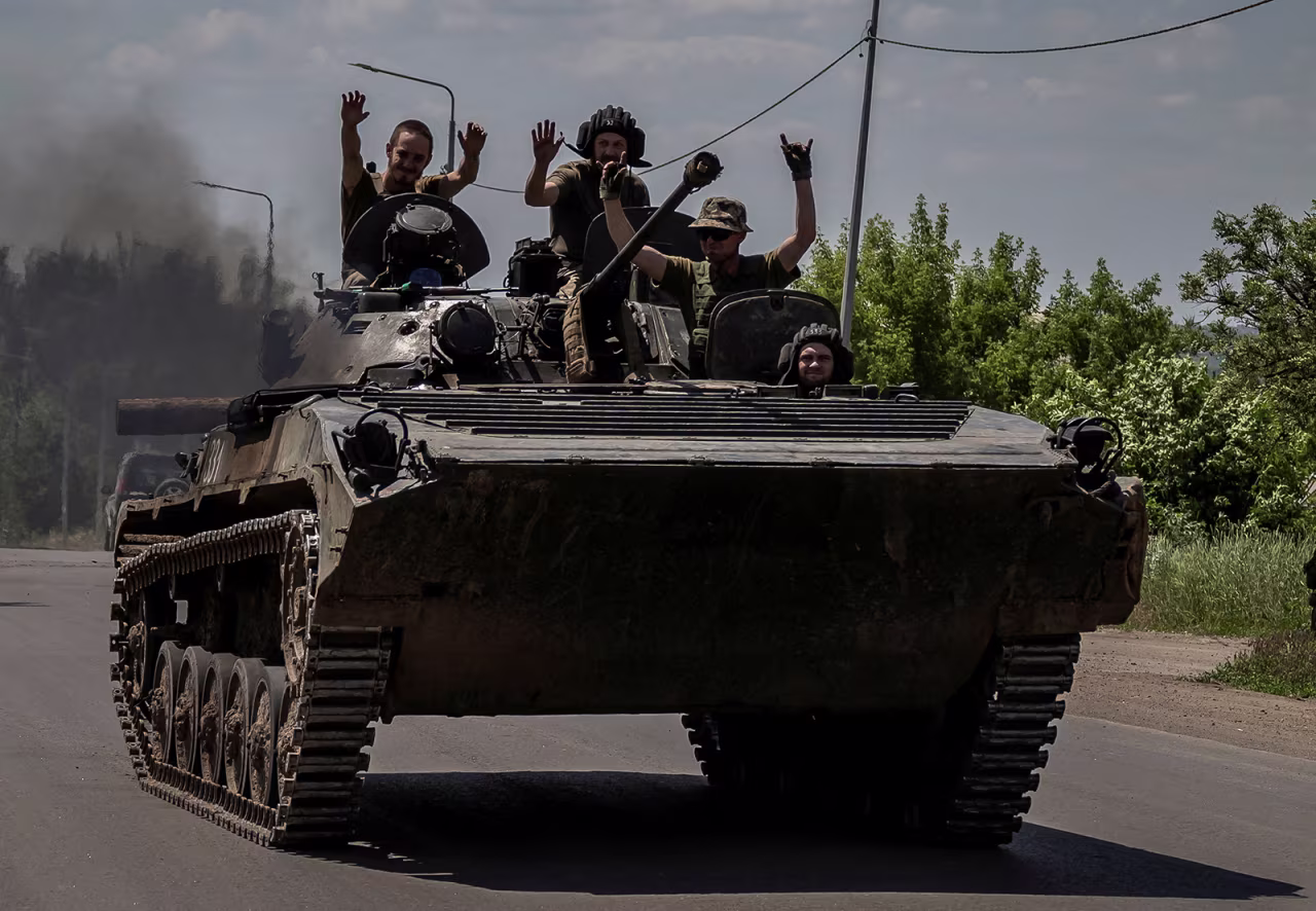 Ukrainian service members ride a BMP-1 infantry fighting vehicle near the frontline city of Bakhmut, Donetsk region, Ukraine on June 9.