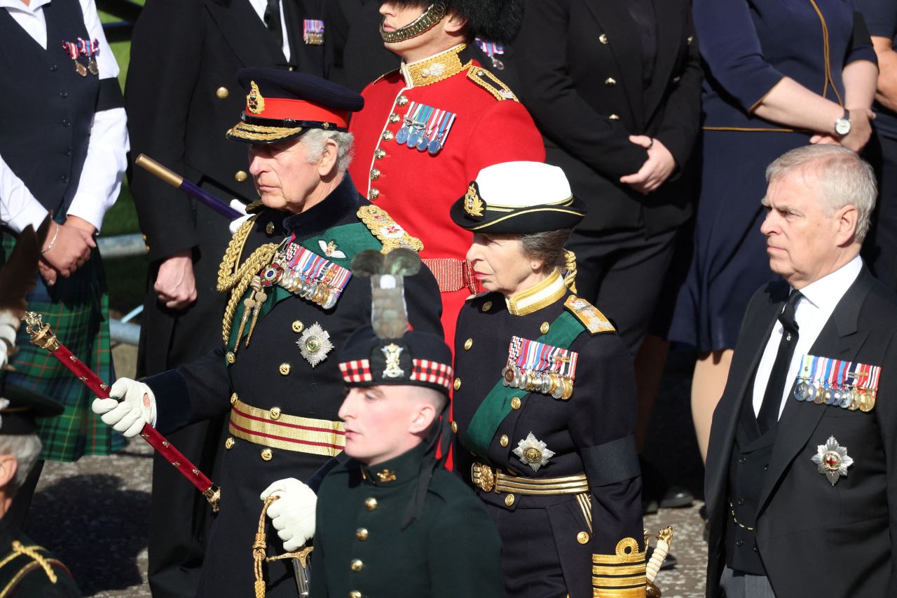 King Charles III, Princess Anne and Prince Andrew walk behind the hearse carrying the coffin of Queen Elizabeth in Edinburgh, Scotland, on Monday.