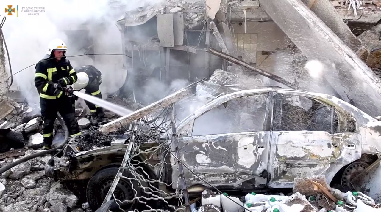 Firefighters work at the site of a Russian military strike in Mykolaiv, Ukraine, in this screengrab taken from a handout video released on July 15.
