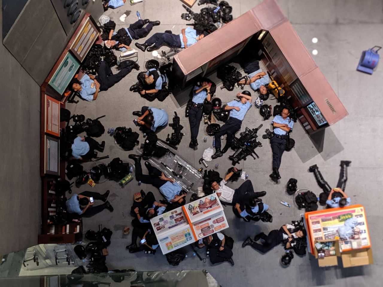 Police officers take rest in the Legislative Council building. 