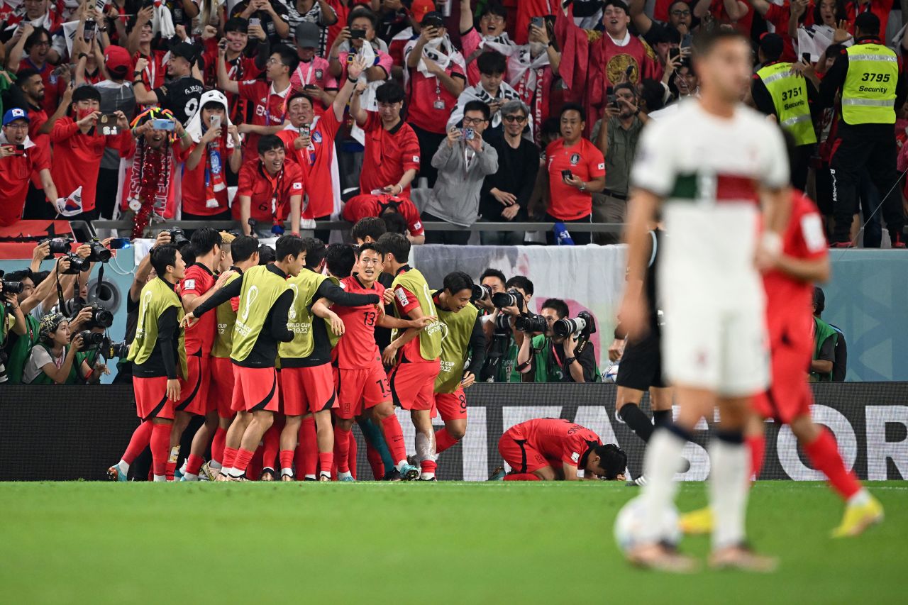 South Korea players celebrate after scoring a second goal against Portugal.