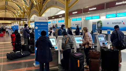 People check in at Washington Reagan National Airport on December 18 in Arlington, Virginia. 