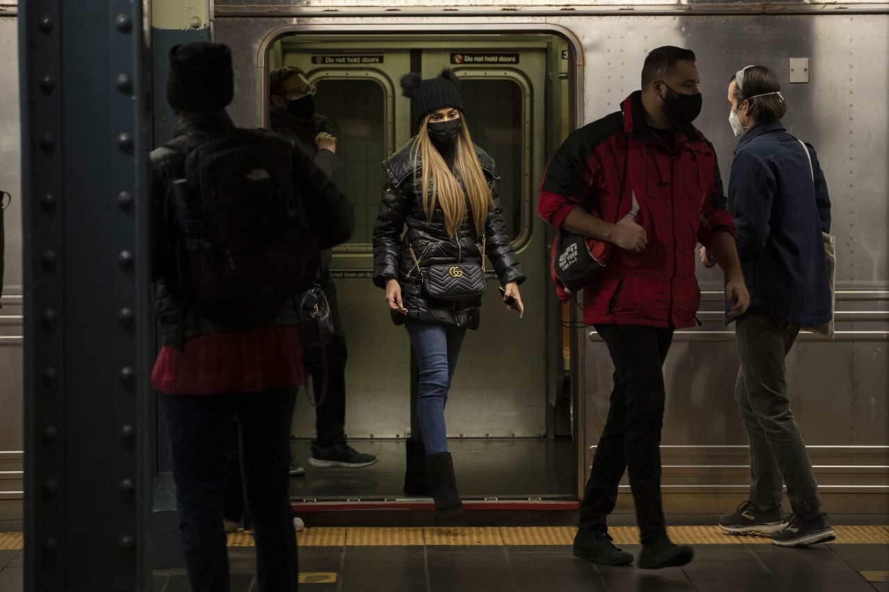 People commute by train at a station in New York on December 10, 2020.