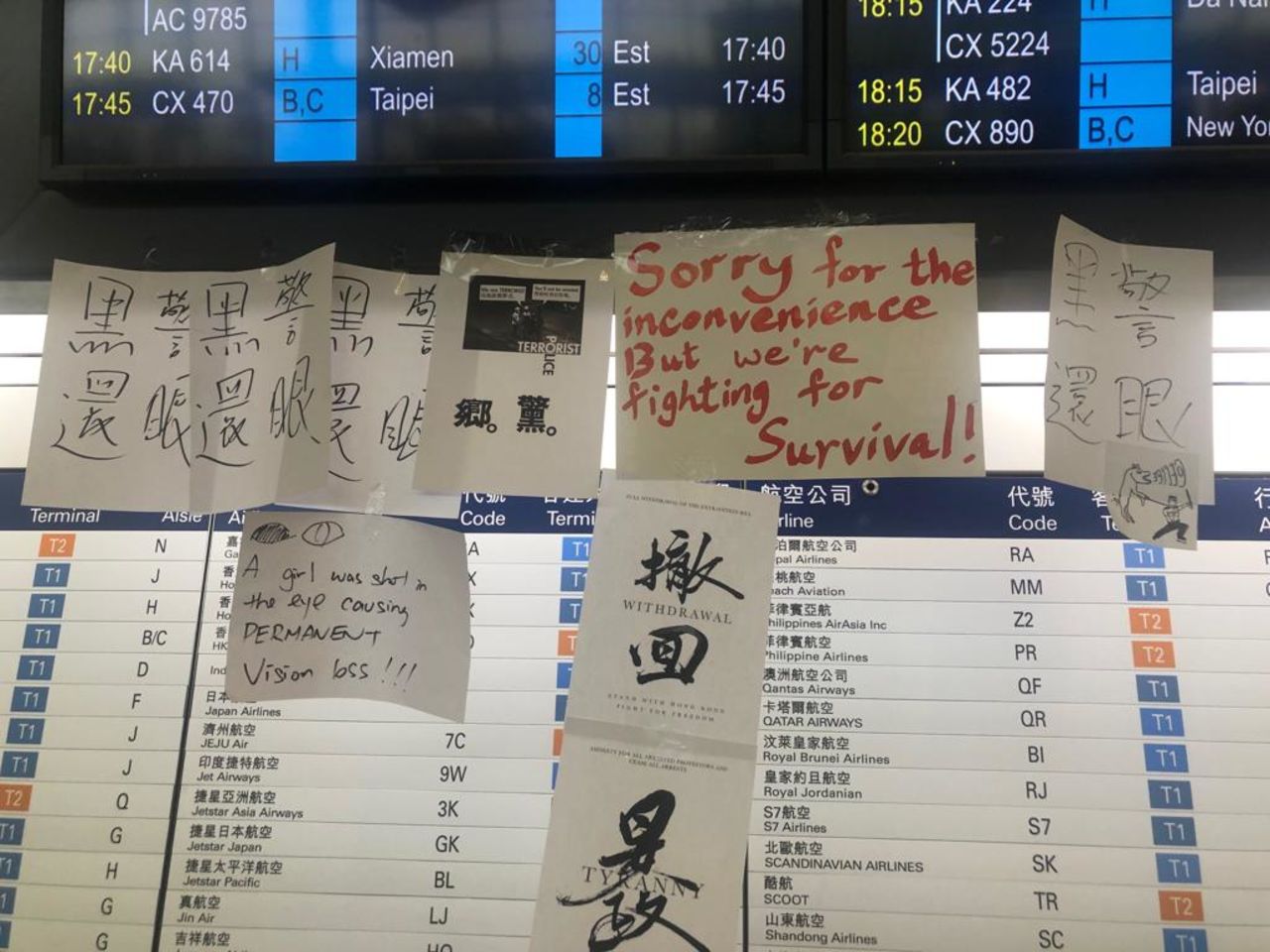 Graffiti and posters are plastered over Hong Kong's airport.