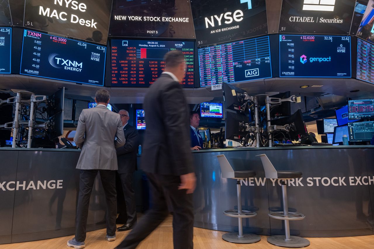 Traders work on the floor of the New York Stock Exchange  on August 5.