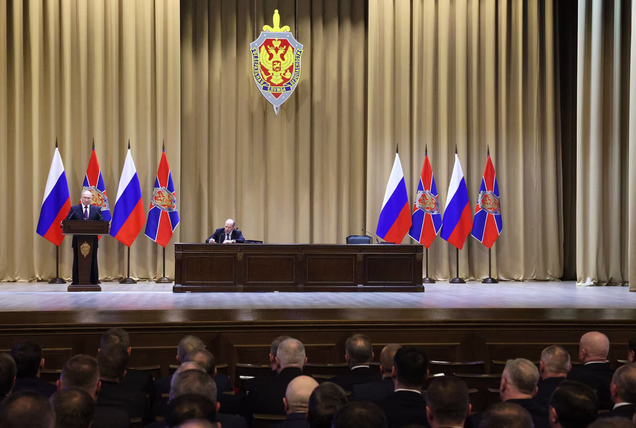 RUSSIA-POLITICS-SECURITYRussian President Vladimir Putin gives a speech as Federal Security Service Director Alexander Bortnikov sits at the table during a meeting of the Federal Security Service (FSB) Board in Moscow, Russia, on February 28.