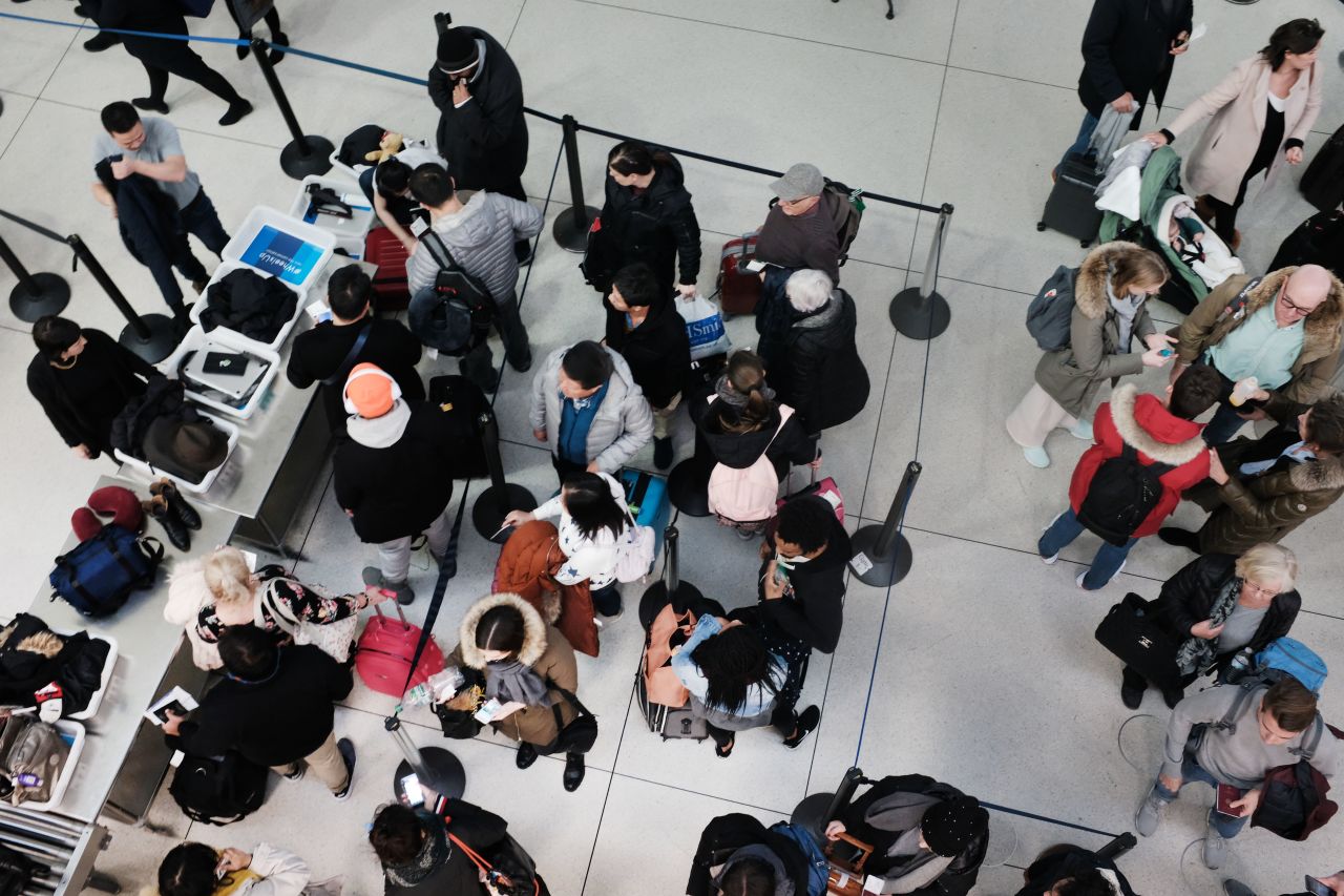 Passengers wait in a TSA line at JFK airport on Wednesday in New York City.