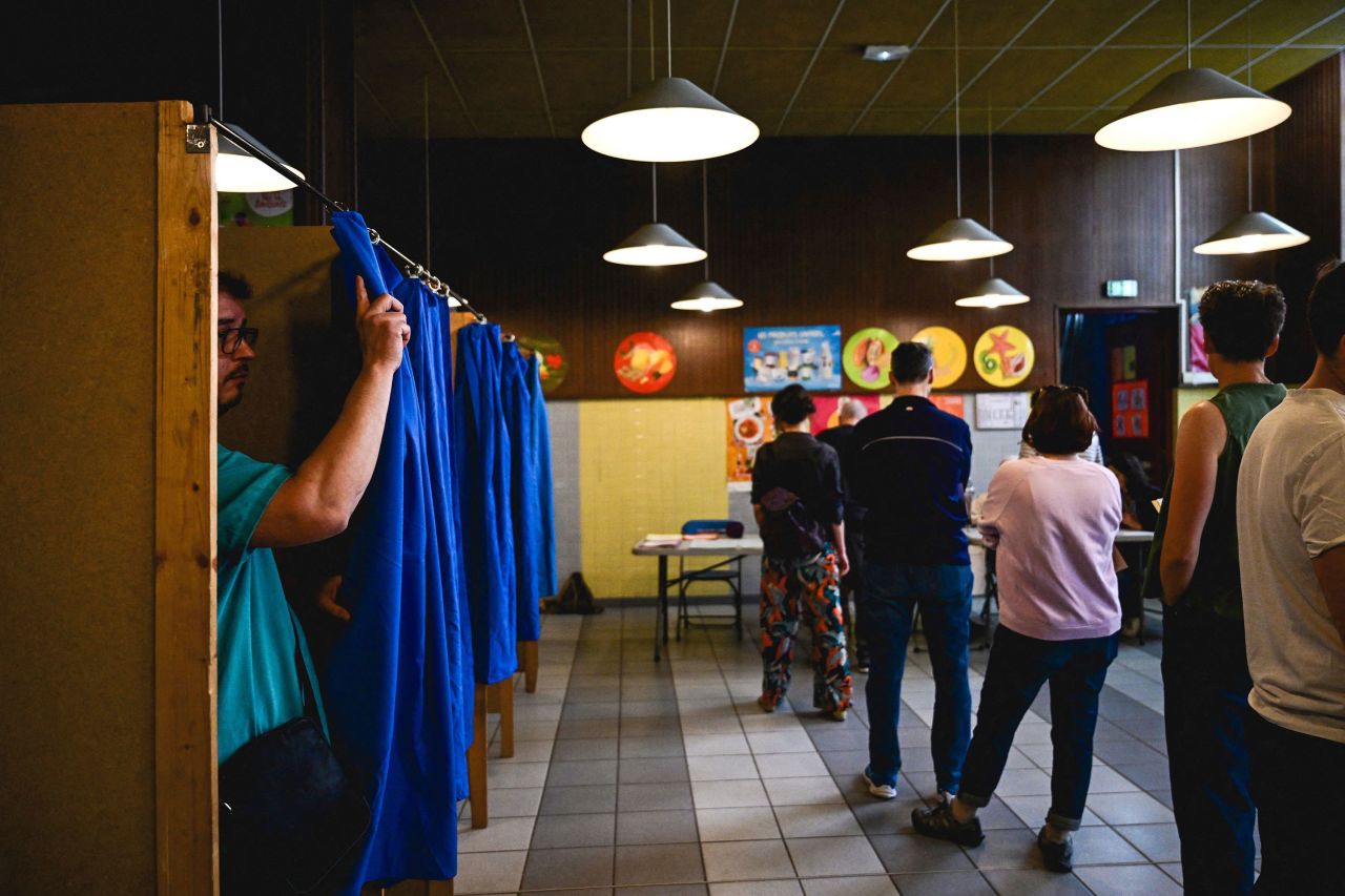 People vote for the European Parliament elections at a polling station in Lyon, France, on June 9.
